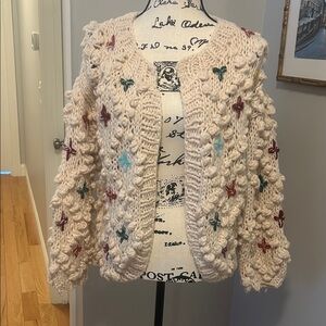 Stylish cardigan with fun accents! Great for layering! 
Size S